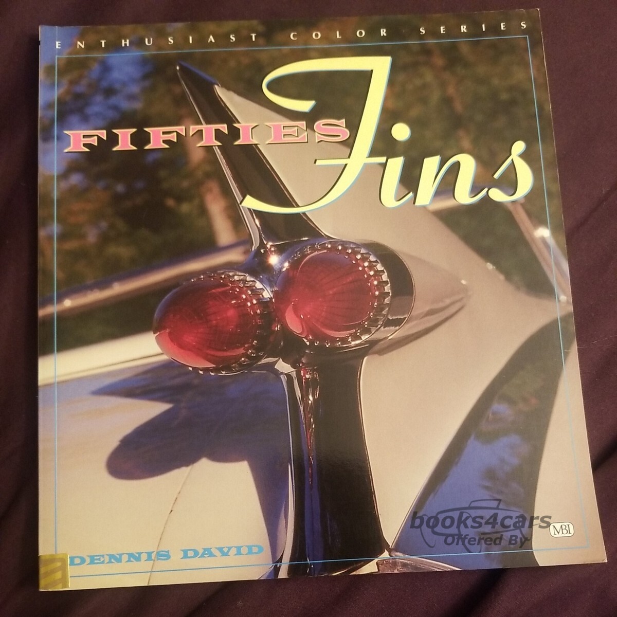 view cover of Fifties Fins Book looks back at the greates auto styling craze, features dozens of modern color photos depicting tail fins and the cars the adorn. 96 pages by Dennis David
